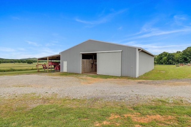 view of outdoor structure featuring a rural view