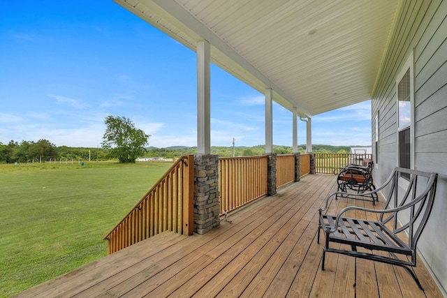 wooden terrace with a yard