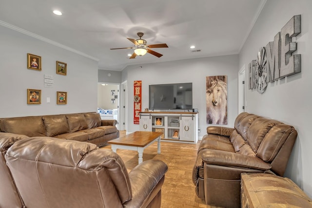 living room featuring ceiling fan, light hardwood / wood-style floors, and ornamental molding