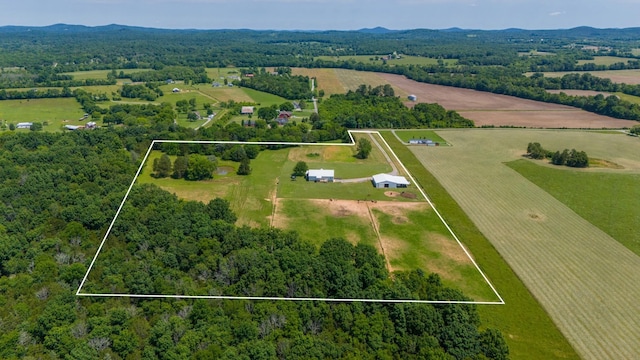 drone / aerial view featuring a mountain view and a rural view