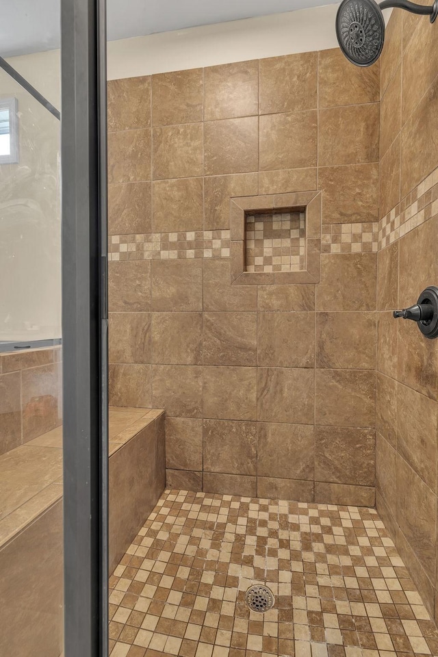 bathroom featuring tiled shower