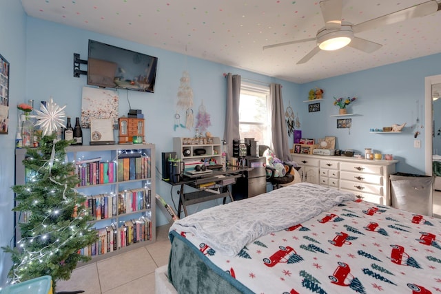 tiled bedroom with ceiling fan