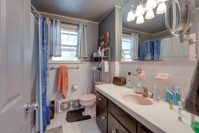 bathroom featuring a shower with shower curtain, tile patterned floors, vanity, tile walls, and toilet