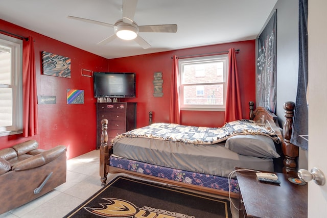 bedroom with ceiling fan and light tile patterned flooring