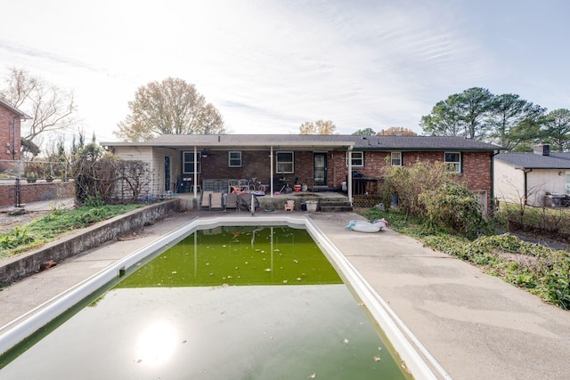 back of house with a patio area