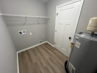 washroom featuring hookup for an electric dryer, wood-type flooring, hookup for a washing machine, and water heater