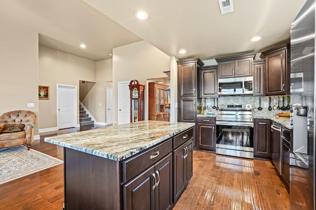 kitchen featuring dark hardwood / wood-style floors, dark brown cabinetry, and stainless steel appliances