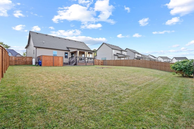 view of yard with a wooden deck