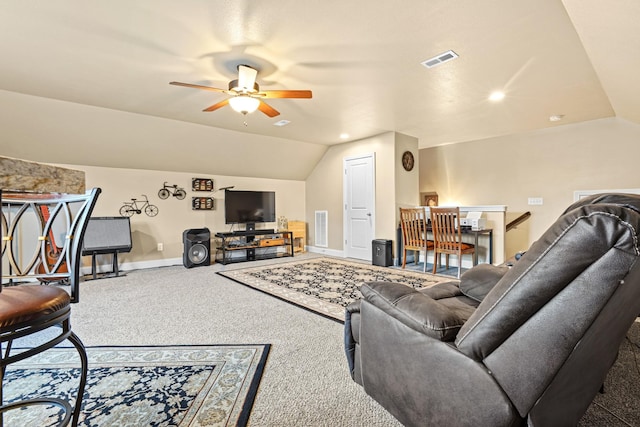 living room featuring carpet flooring, ceiling fan, and vaulted ceiling