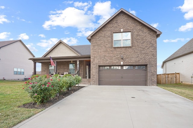 front of property featuring covered porch, a garage, a front lawn, and cooling unit