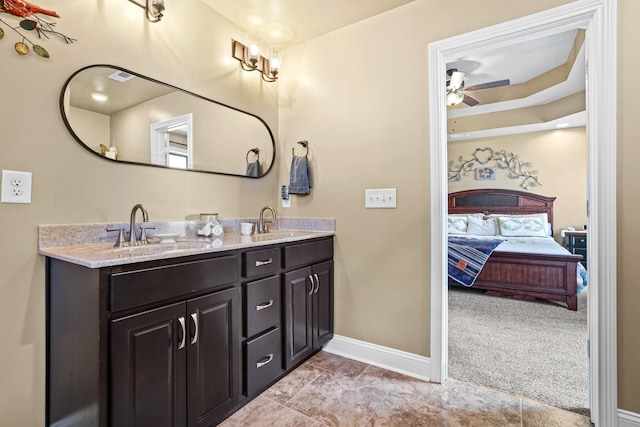 bathroom featuring ceiling fan and vanity