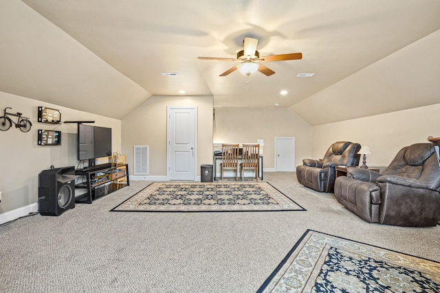 carpeted living room with ceiling fan and lofted ceiling