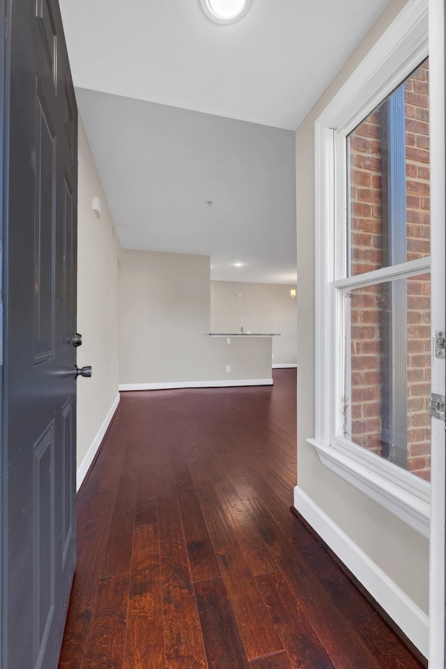 spare room with dark hardwood / wood-style flooring