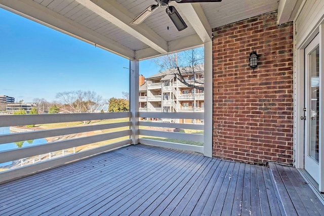 wooden terrace featuring ceiling fan