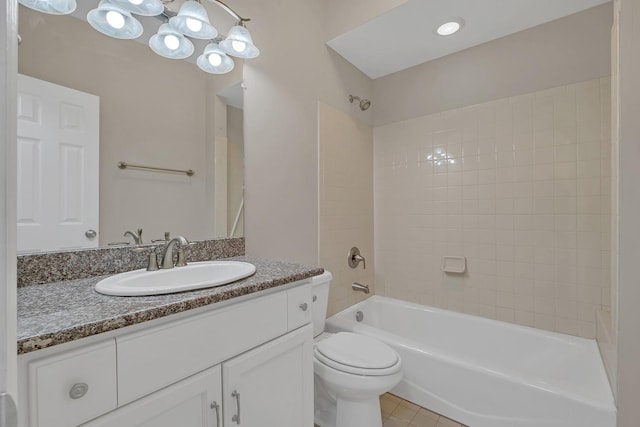 full bathroom featuring tile patterned floors, vanity, bathtub / shower combination, and toilet