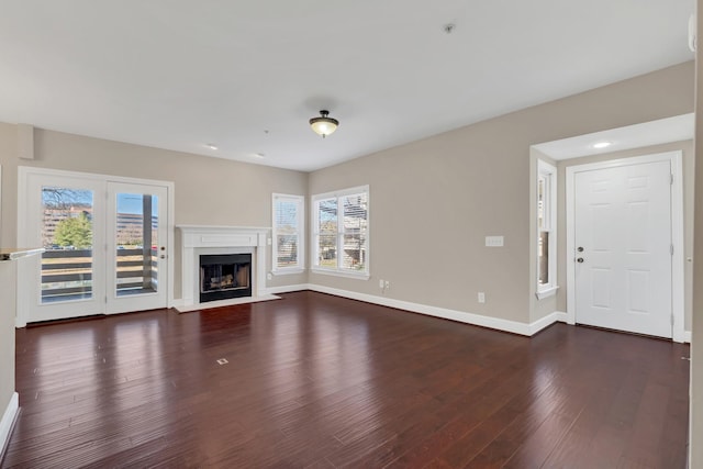 unfurnished living room featuring dark wood-type flooring