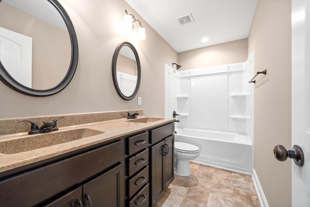 full bathroom featuring vanity, toilet, and bathtub / shower combination