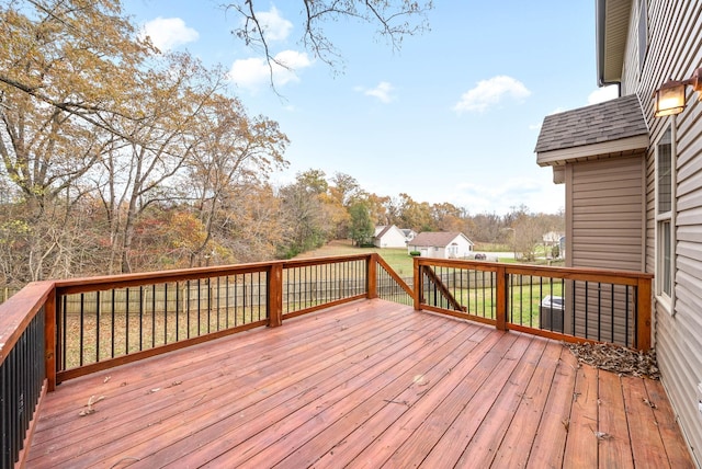 wooden terrace with a yard