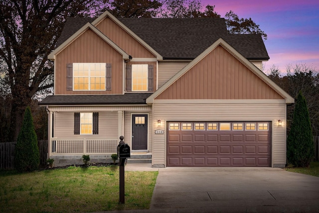 craftsman-style house with a lawn, a porch, and a garage