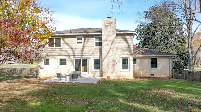 rear view of property featuring a lawn, a patio area, and central air condition unit