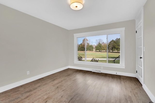 spare room featuring dark hardwood / wood-style floors