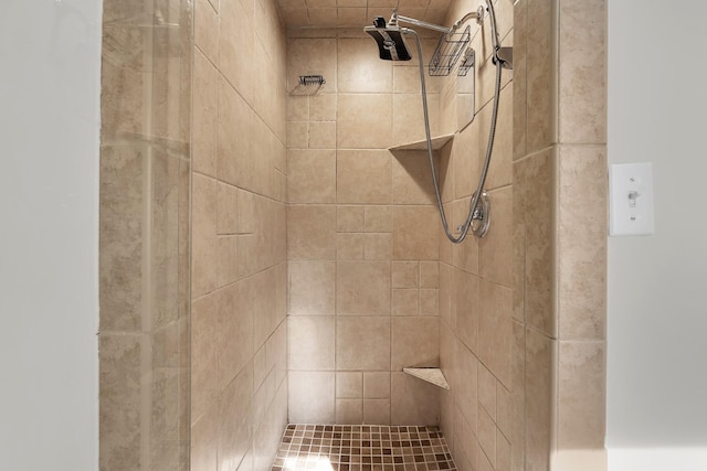 bathroom with tiled shower