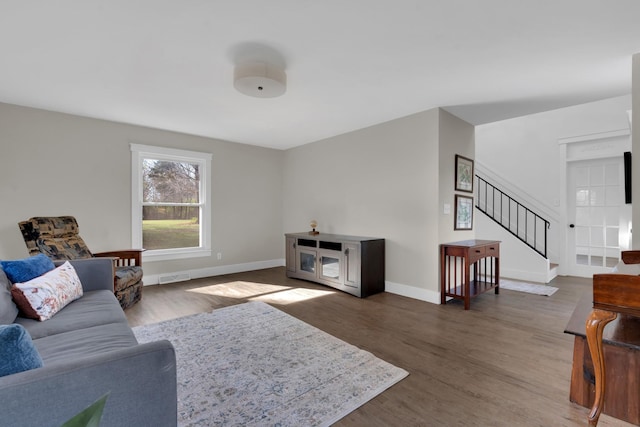 living room with dark hardwood / wood-style flooring