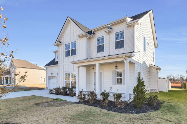 view of front facade with a front yard and a garage