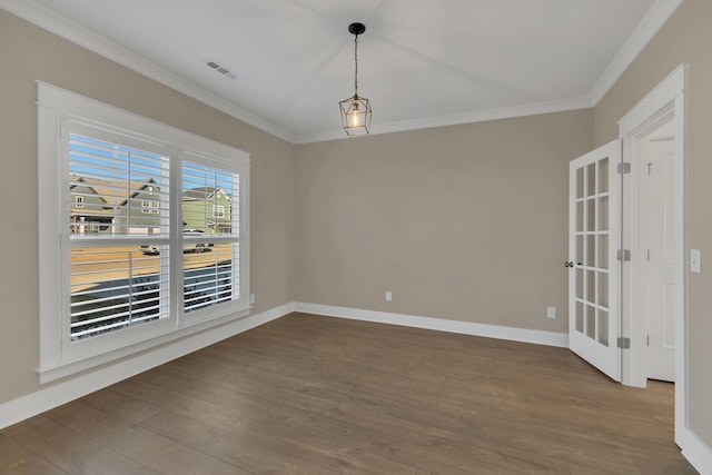 unfurnished dining area with hardwood / wood-style flooring and crown molding