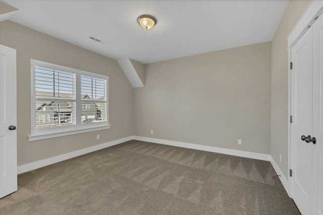 unfurnished bedroom featuring carpet floors and a closet