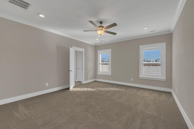 unfurnished room featuring ceiling fan, ornamental molding, and carpet floors