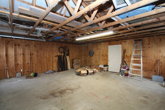 garage featuring wood walls