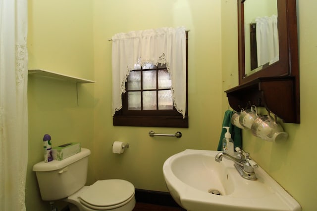 bathroom with toilet and sink