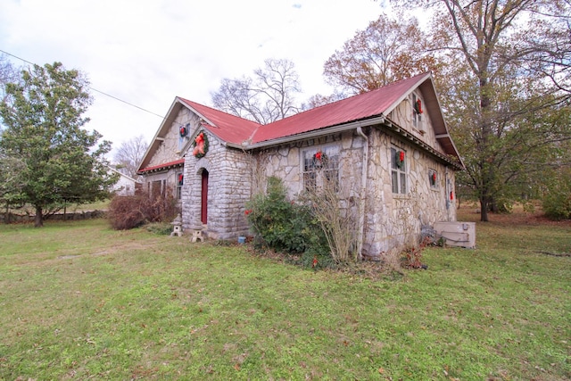 view of property exterior featuring a lawn