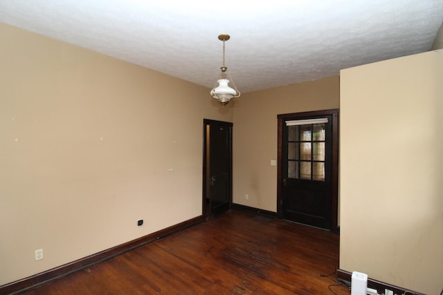 unfurnished room featuring dark hardwood / wood-style flooring