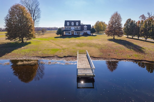 dock area featuring a yard and a water view