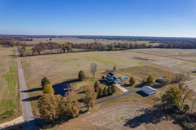 birds eye view of property with a rural view