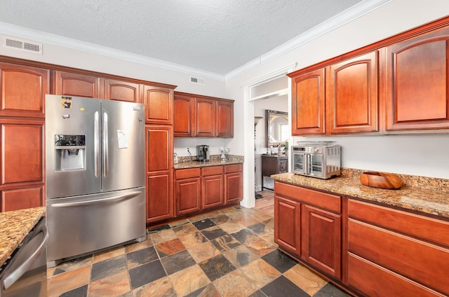 kitchen with light stone countertops, appliances with stainless steel finishes, a textured ceiling, and crown molding