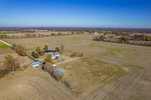 birds eye view of property with a rural view