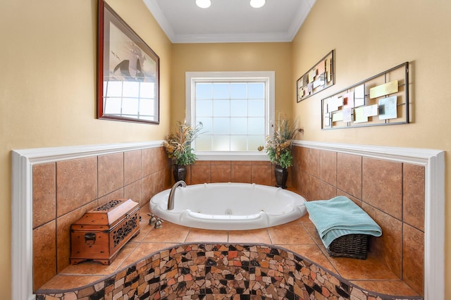 bathroom with tiled bath and ornamental molding