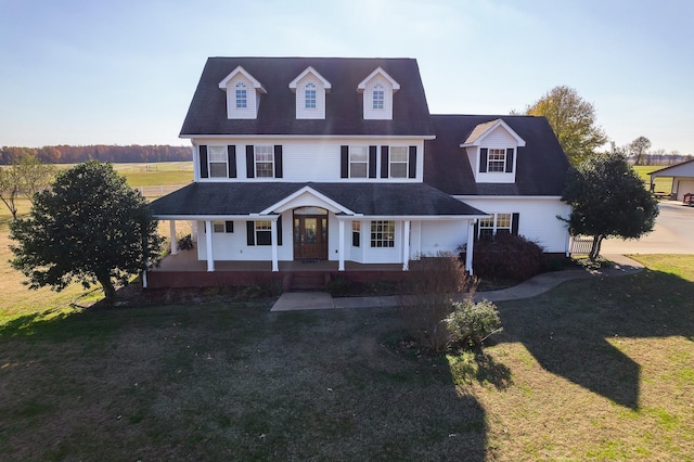 view of front of home with a porch and a front lawn