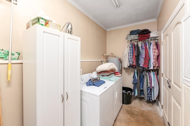 laundry area featuring water heater, ornamental molding, a textured ceiling, and separate washer and dryer