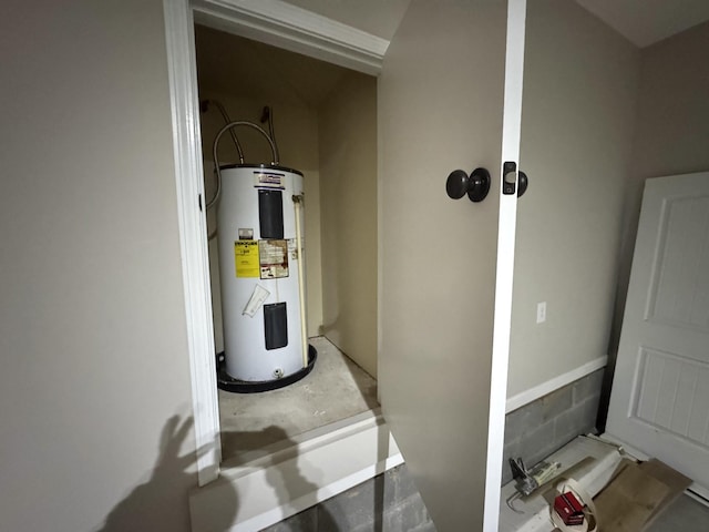 utility room with electric water heater