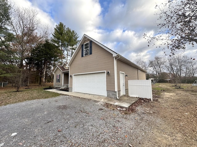 view of property exterior featuring a garage