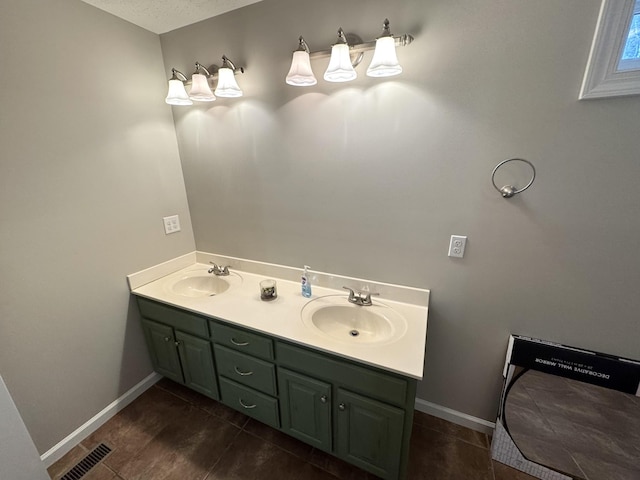 bathroom featuring vanity, wood-type flooring, and a textured ceiling