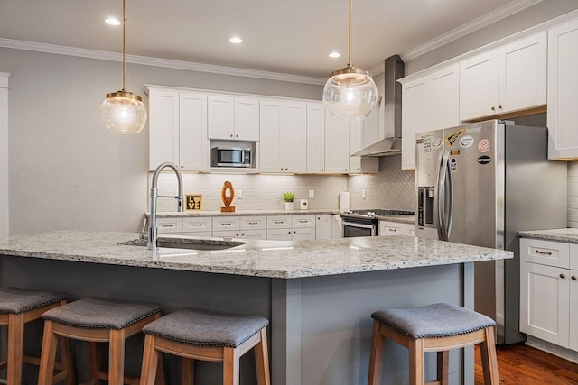 kitchen featuring white cabinetry, sink, wall chimney exhaust hood, and appliances with stainless steel finishes