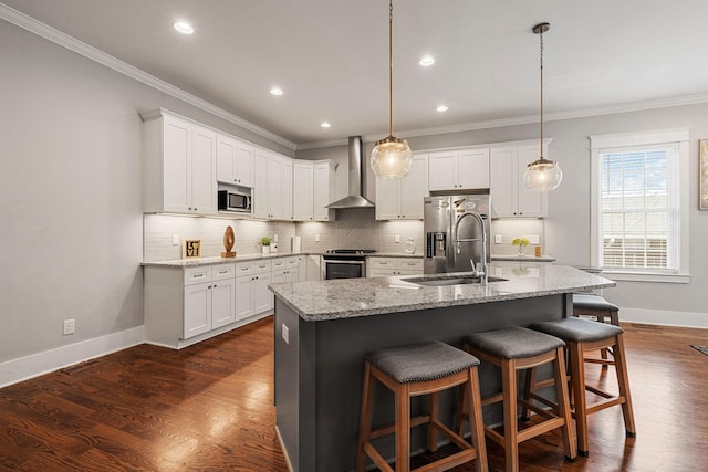 kitchen featuring white cabinets, wall chimney exhaust hood, dark hardwood / wood-style flooring, and appliances with stainless steel finishes