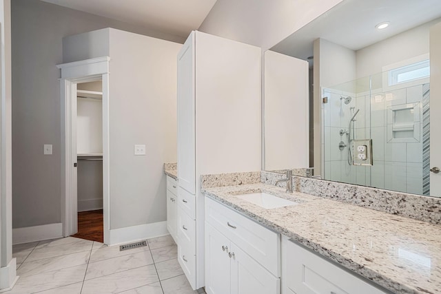 bathroom featuring vanity and walk in shower