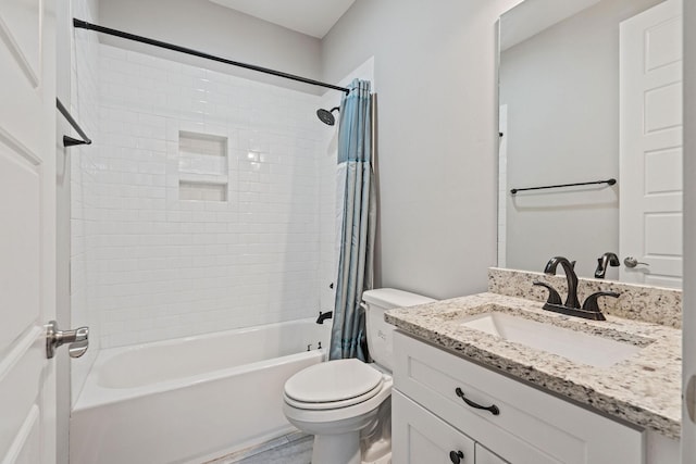 full bathroom featuring vanity, shower / tub combo, and toilet