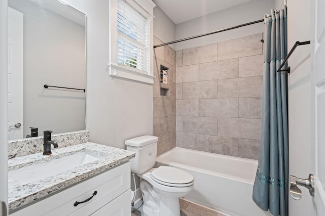 full bathroom featuring tile patterned flooring, vanity, toilet, and shower / bathtub combination with curtain